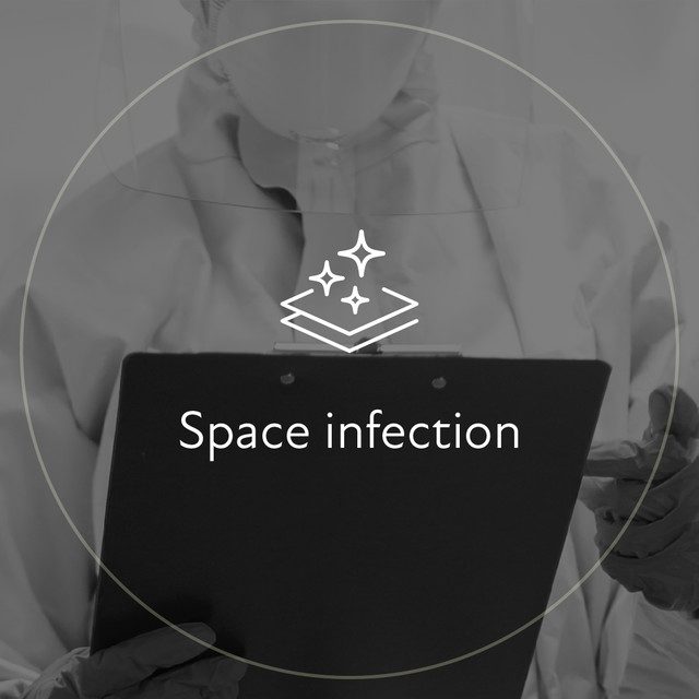 Space disinfection: icon over a staff member in protective gear holding a tablet